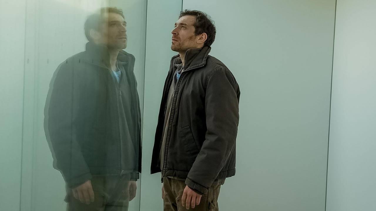 A man looking at his reflection