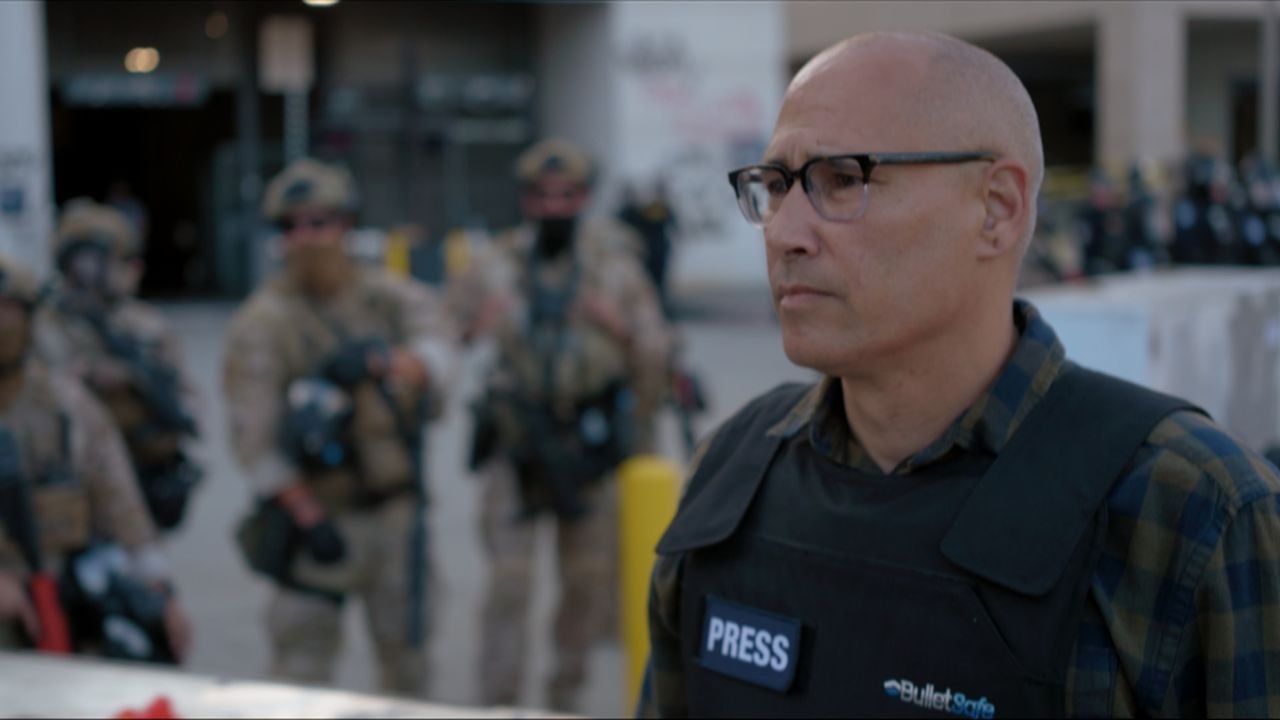 A journalist covering an immigration raid