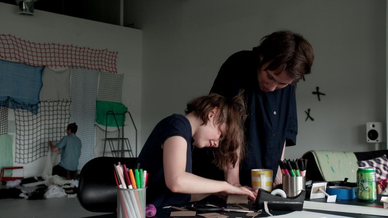 A mom and child complete a craft