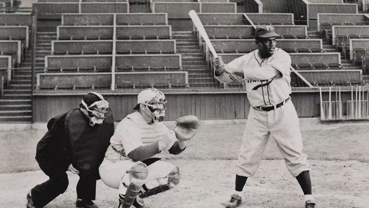 Jackie Robinson practicing on the field