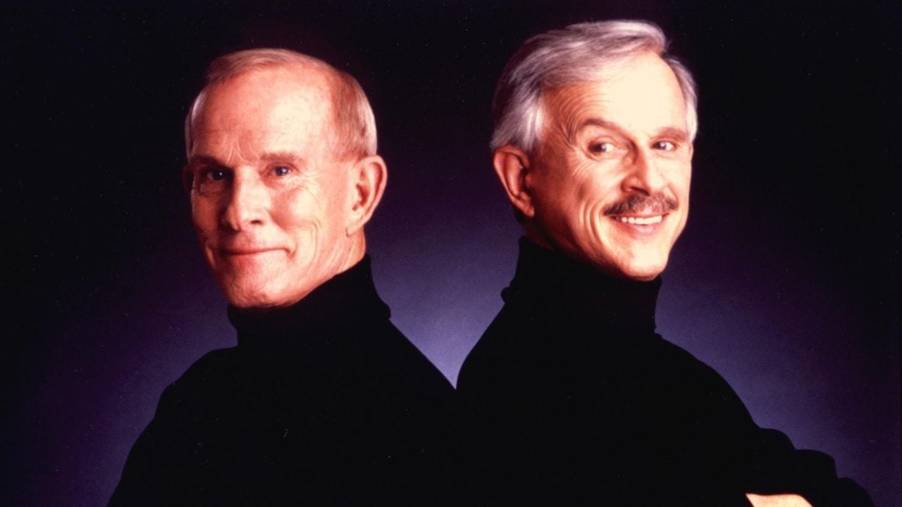 Two men standing back-to-back