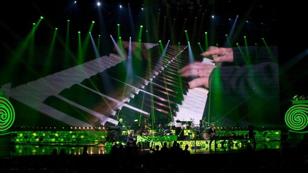elton john playing the piano