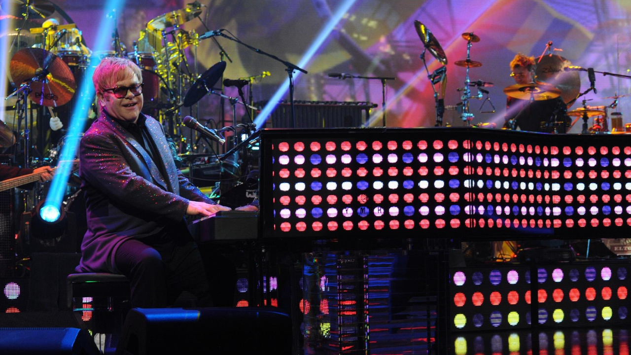 Elton John playing the piano