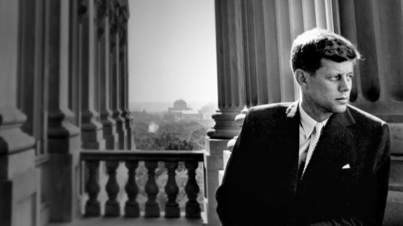 A black and white photo of JFK