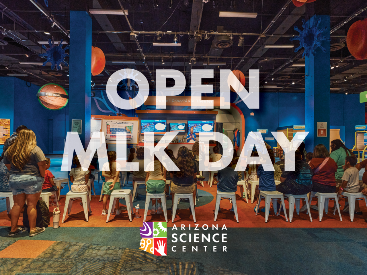An interior photo of the Arizona Science Center with text reading: Open MLK Day